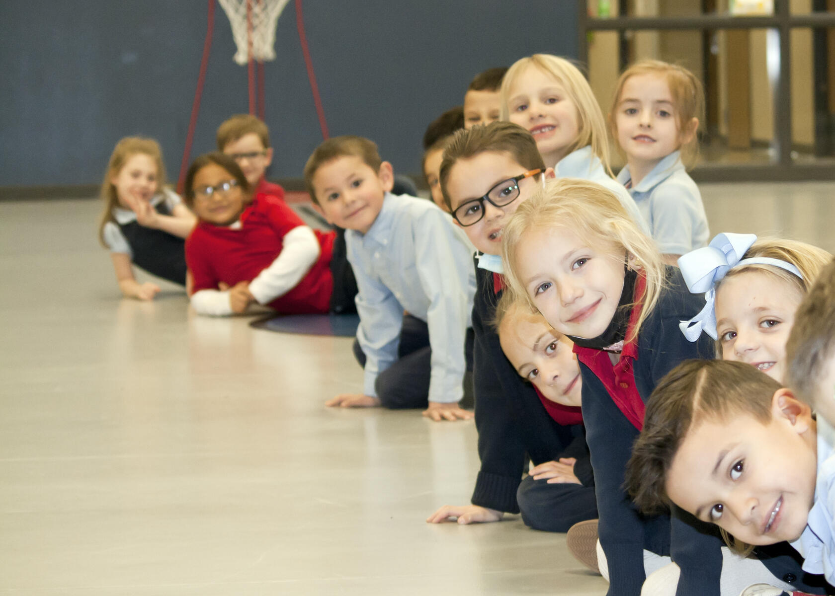 kindergarteners at PE on floor